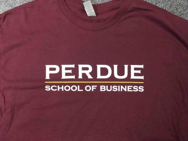 Perdue School of Business Maroon shirt with front screen print in white and yellow reads Perdue School of Business.