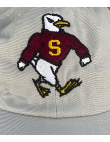 Salisbury University White hat with embroidered Salisbury University mascot Sammy the Seagull in white, yellow, black and maroon thread.